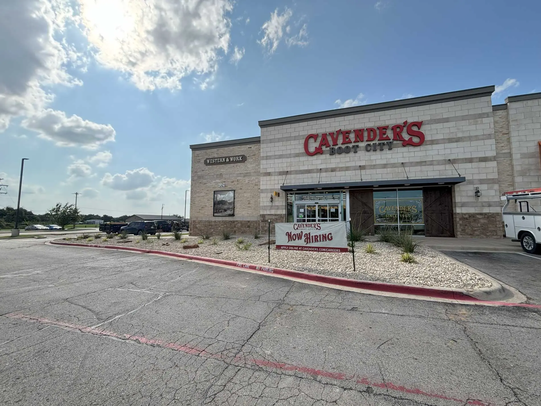 Finished commercial landscaping with rock beds and planting at a Granbury retail property