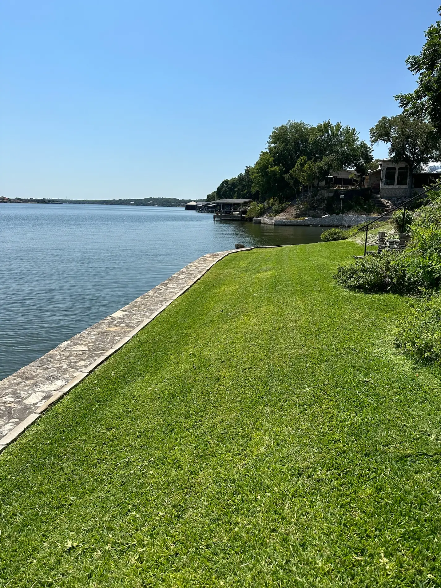 Maintained lakefront turf on a larger Granbury property
