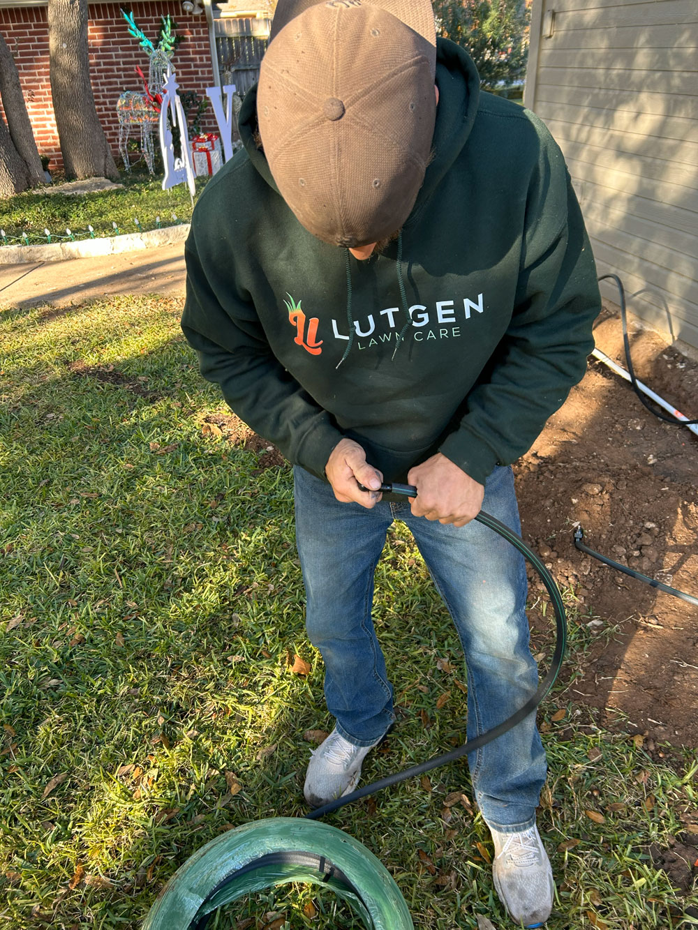 Lutgen crew member preparing irrigation line